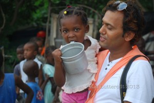 'Paudel' during the distribution of food to children living in camps