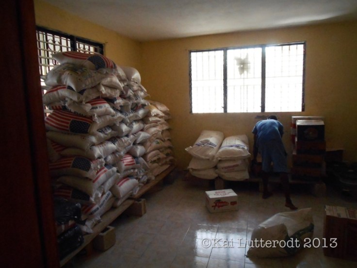 Tibayo helps organise the store room 